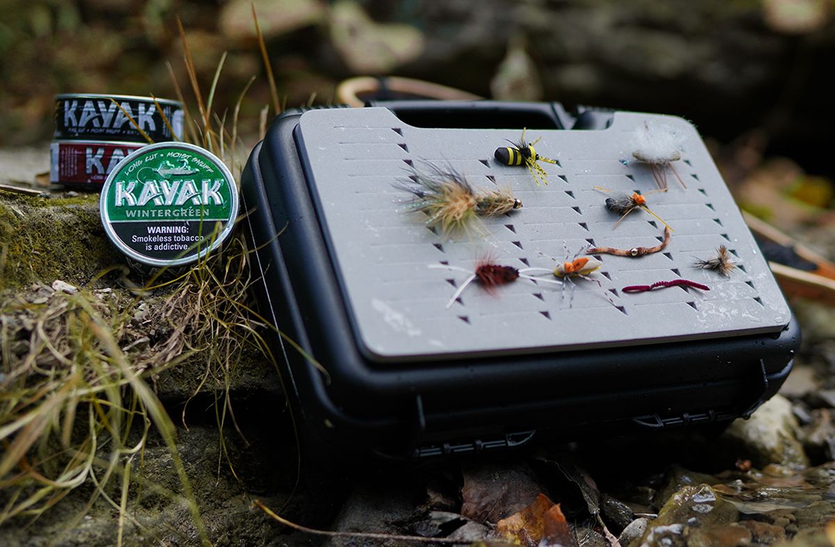 Top down shot of essential fishing gear. Ensure kayak products are featured in the shot.