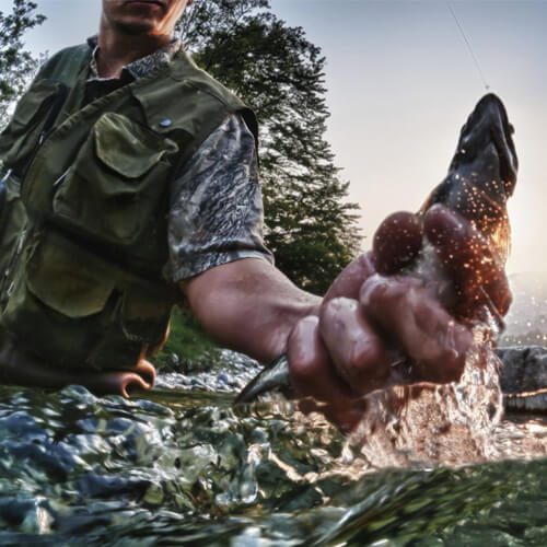 Fisherman with fish in his hand