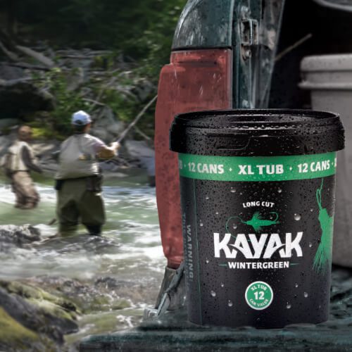 Two fishermen wading in a lake with an XL tub of Kayak Wintergreen on a truck tailgate