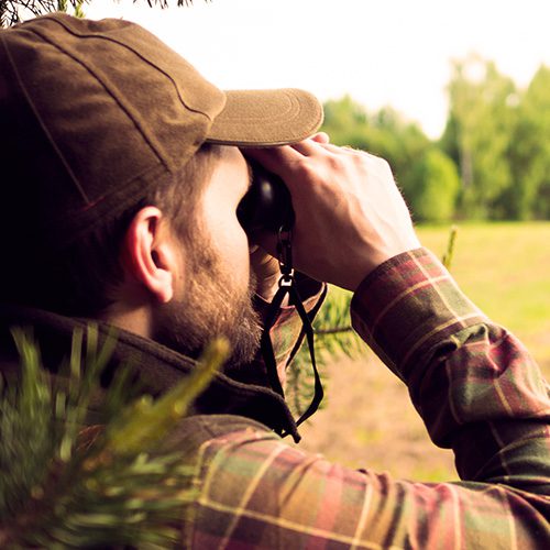 Hunter with binoculars